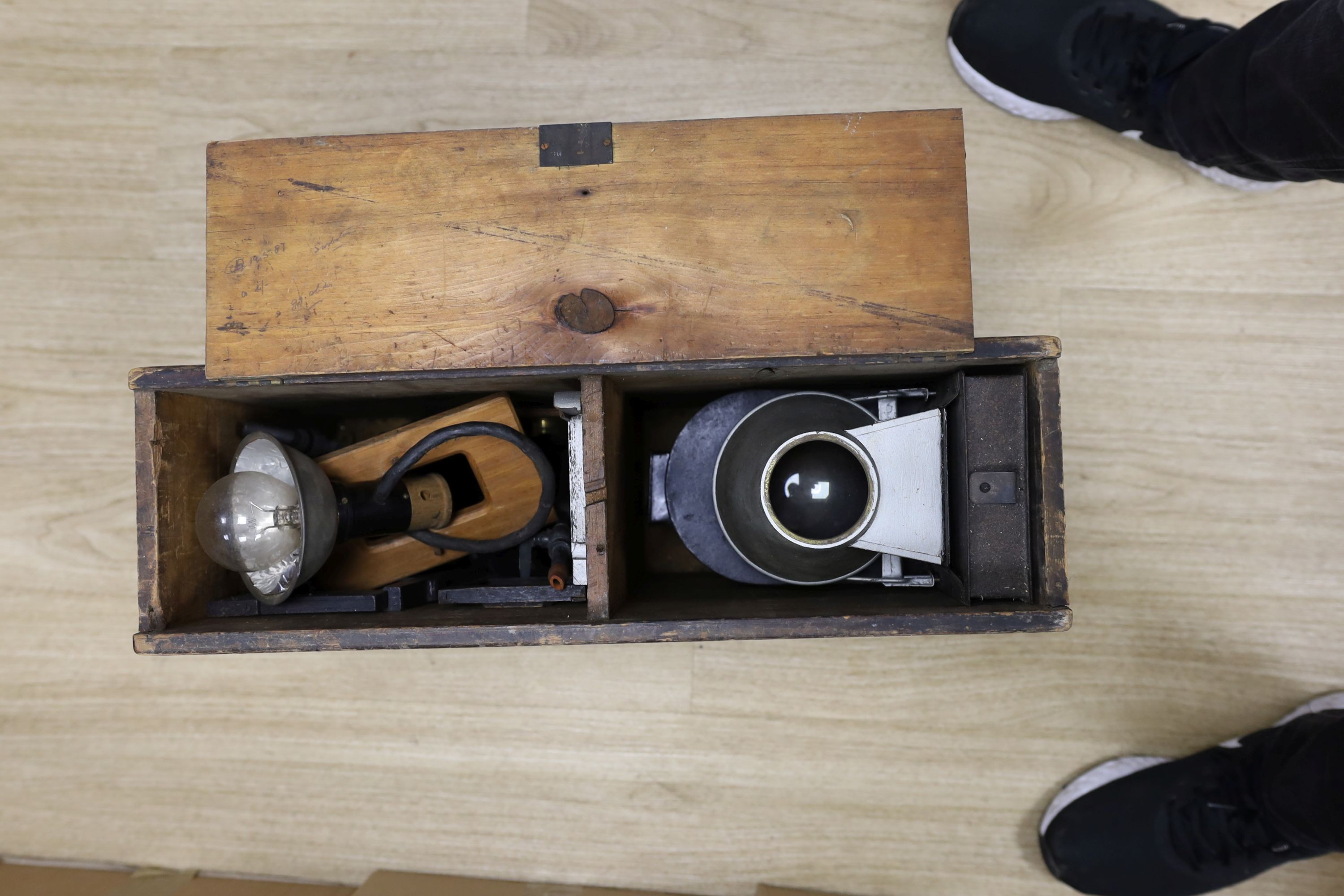 A late 19th century Magic lantern, cased with slides